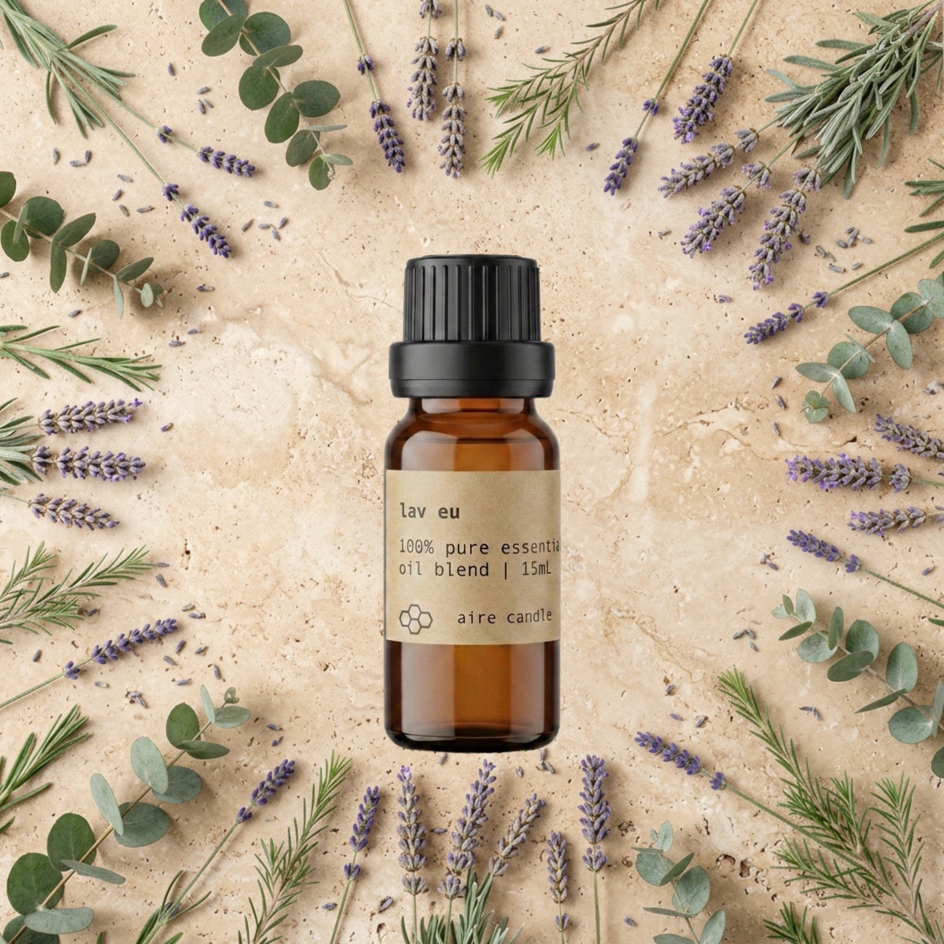 Bottle of Aire Candle Co. Lav Eu Essential Oil Blend Surrounded by Scent Notes of Lavender, Eucalyptus, Balsam Fir and Tea Tree Essential Oils on a Travertine Surface.