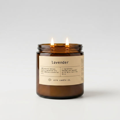 Lavender essential oil scented beeswax candle featured in the 16 oz size with two wicks housed in an amber glass jar.