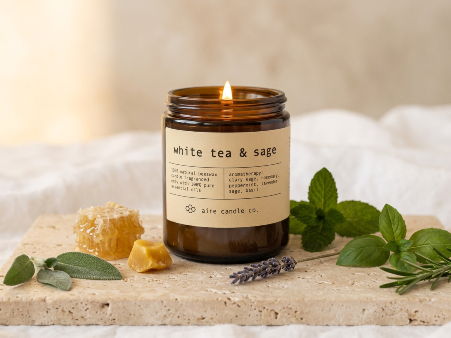 White Tea & Sage candle surrounded with beeswax, honeycomb, peppermint, basil, rosemary, sage and lavender.