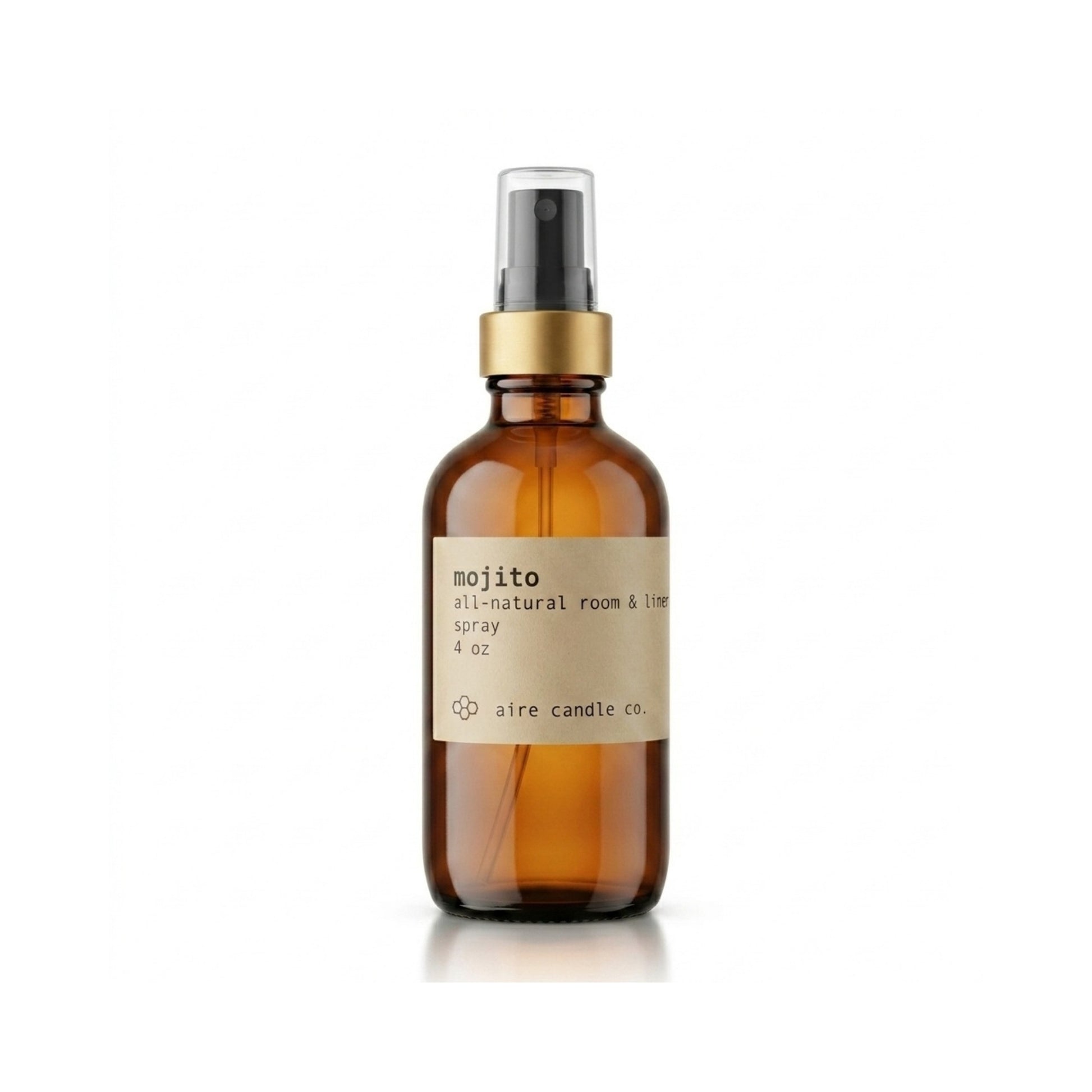 Aire Candle Co. Mojito Essential Oil Scented Room Spray Displayed Against a Clean White Background Housed in a Protective Amber Glass Bottle with a Gold Rim and Black Fine Mist Sprayer.