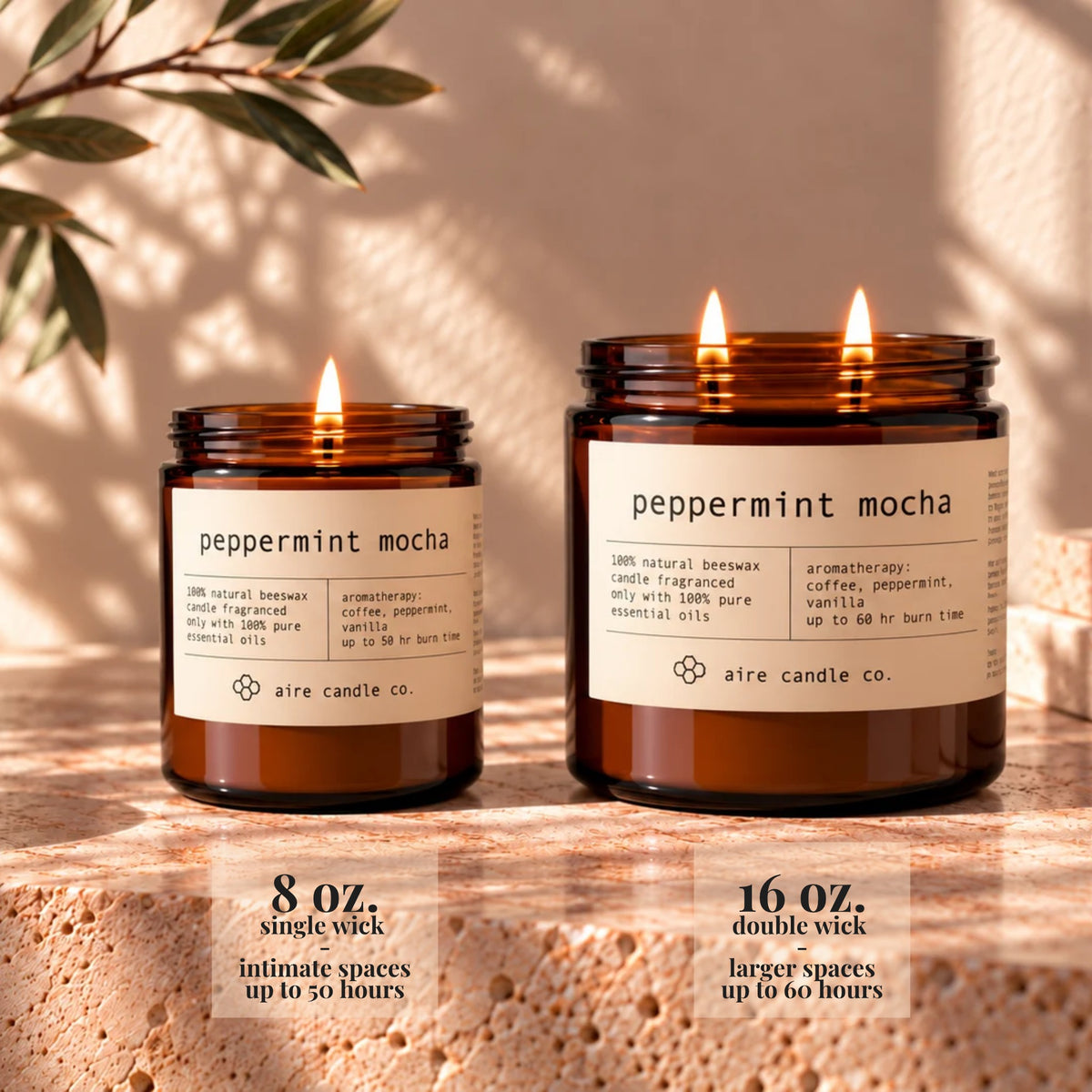 8 oz aire candle displayed next to the 16 oz beeswax candle. The 8 oz has a single wick and is intended for intimate spaces. It burns up to 50 hours. The 16 oz candle has two wicks and is intended for larger spaces. It burns up to 60 hours.