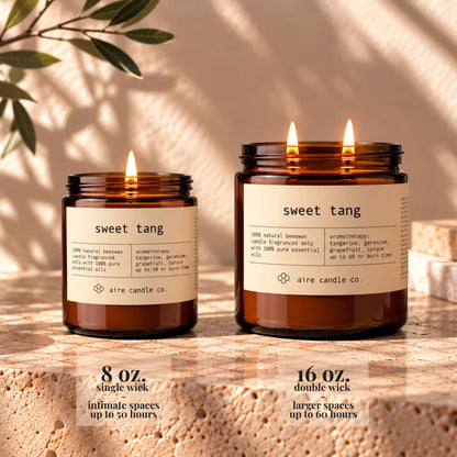 8 oz aire candle displayed next to the 16 oz beeswax candle. The 8 oz has a single wick and is intended for intimate spaces. It burns up to 50 hours. The 16 oz candle has two wicks and is intended for larger spaces. It burns up to 60 hours.