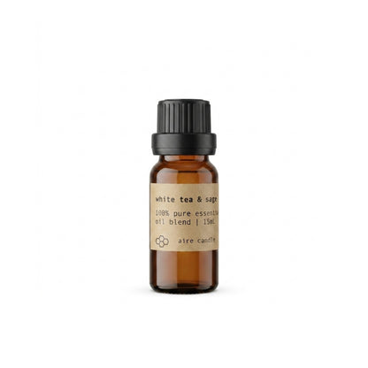 Aire Candle Co. White Tea & Sage Essential Oil Blend Displayed Against a Clean White Background Housed in a 15mL Protective Amber Glass Bottle.