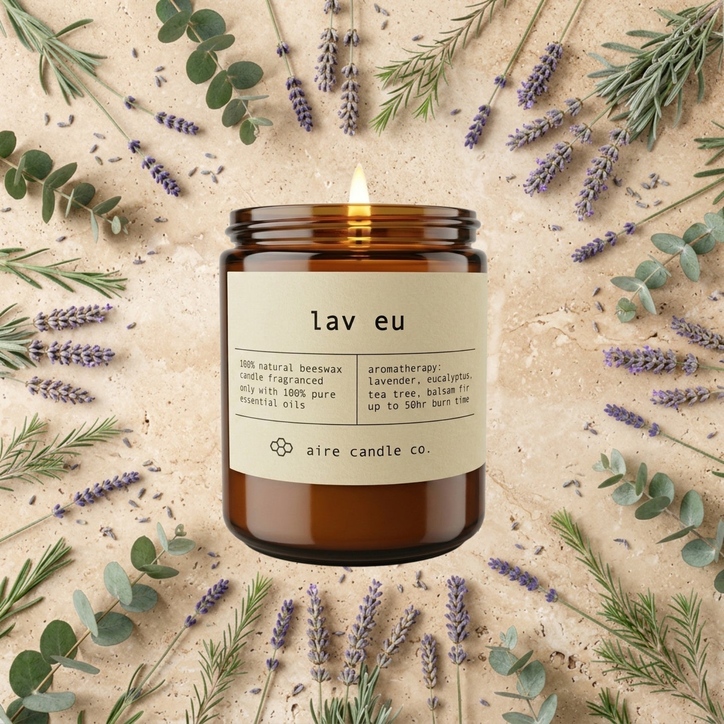 Lav Eu candle from aire candle co surrounded by lavender, eucalyptus, tea tree and balsam fir on a light travertine background.