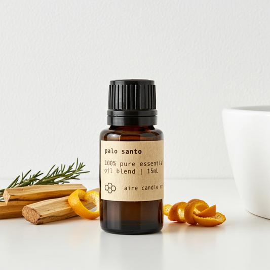 Palo Santo essential oil bottle with packaging on a white background