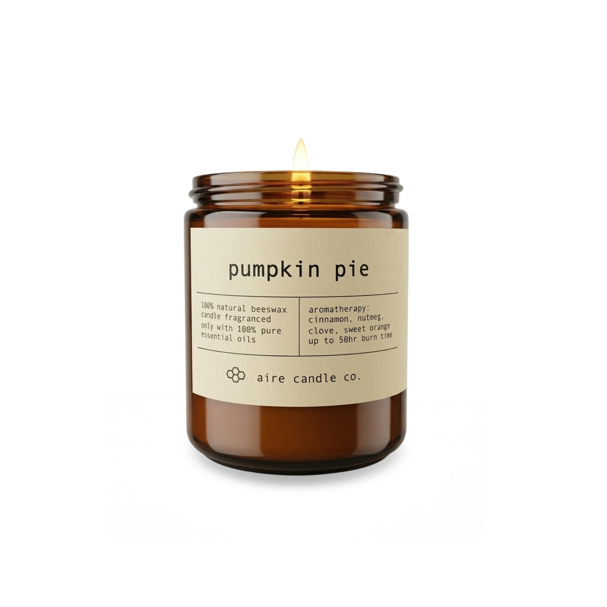 Aire Candle Co. Pumpkin Pie Essential Oil Scented Beeswax Candle Displayed with an Illuminated Flame Housed in a Protective Amber Glass Jar.