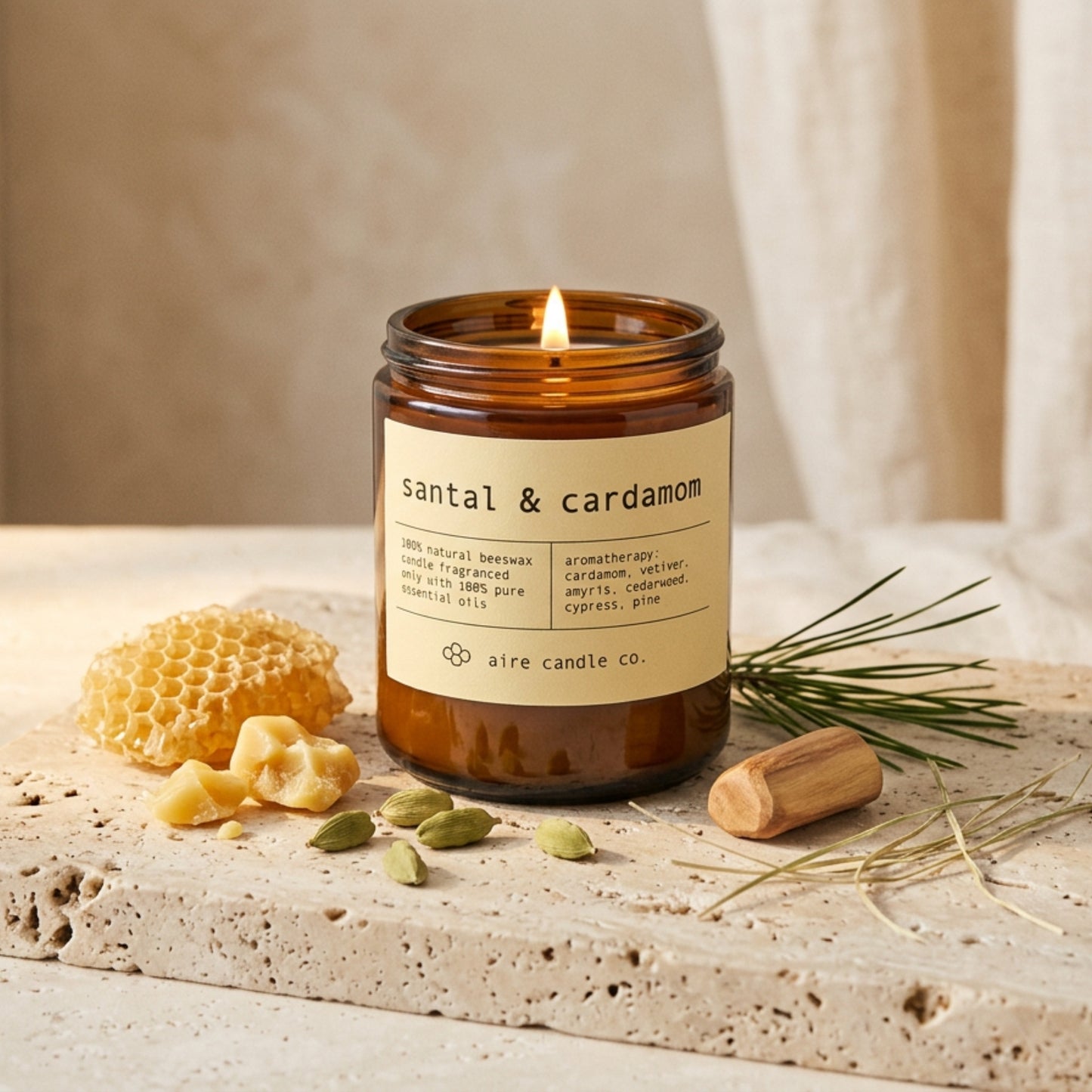 Aire Candle Co. Santal & Cardamom candle with ingredients on a stone surface